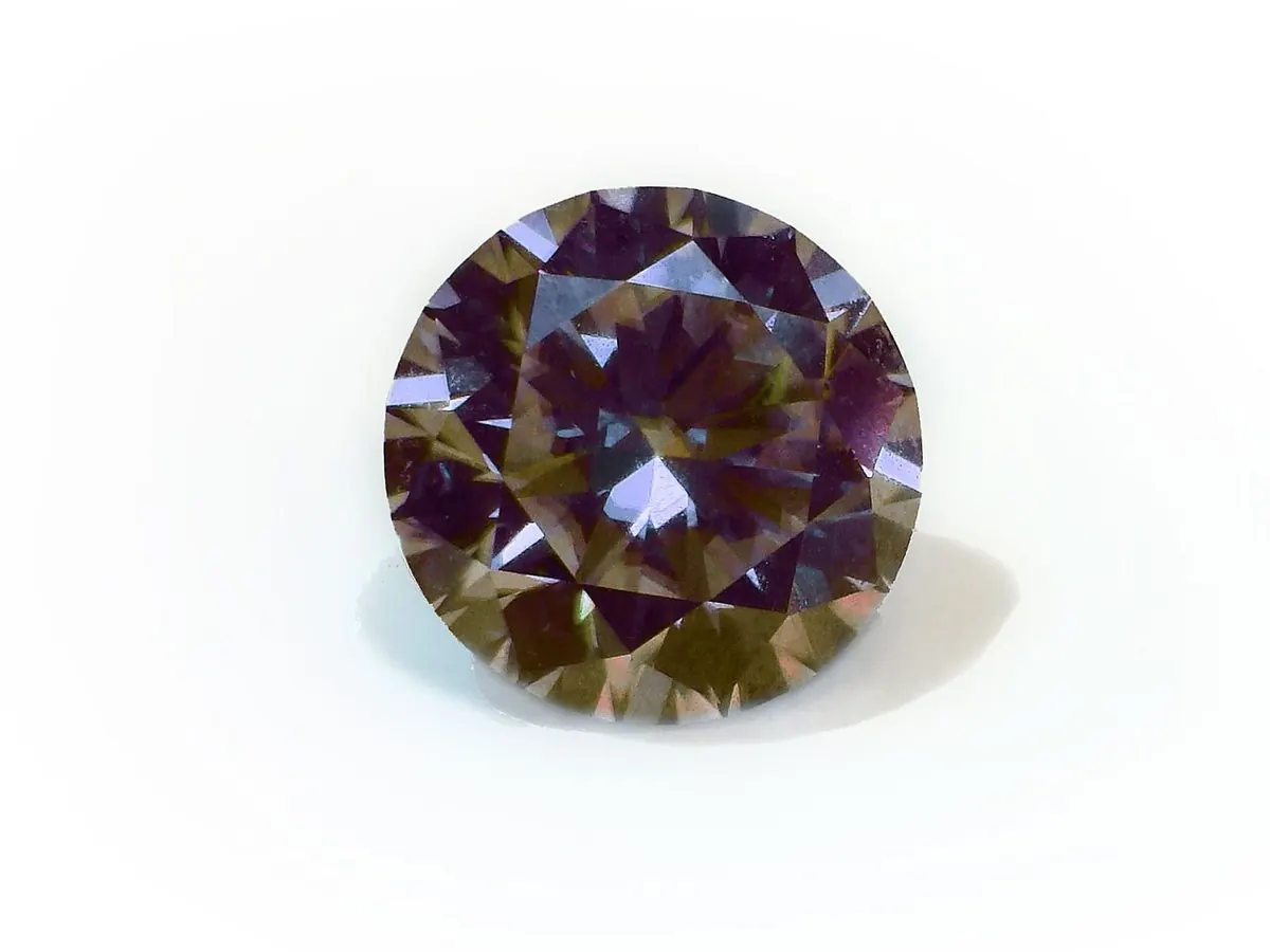 Round cut synthetic silicon carbide with a visible brownish body color